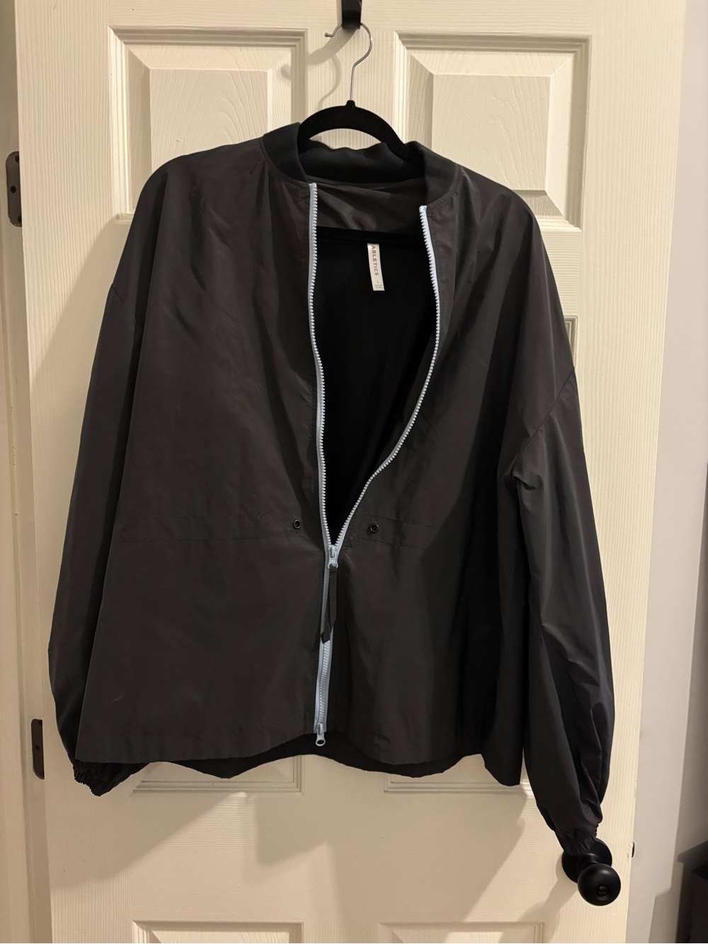 Fabletics Black Windbreaker with Light Blue Zip